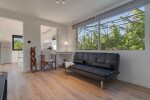 First Floor Apartment with a sofa bed for 1 adult and a television.