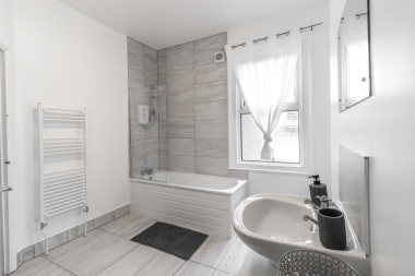 Bright bathroom with bathtub