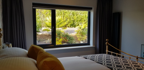 Second bedroom with peaceful garden views