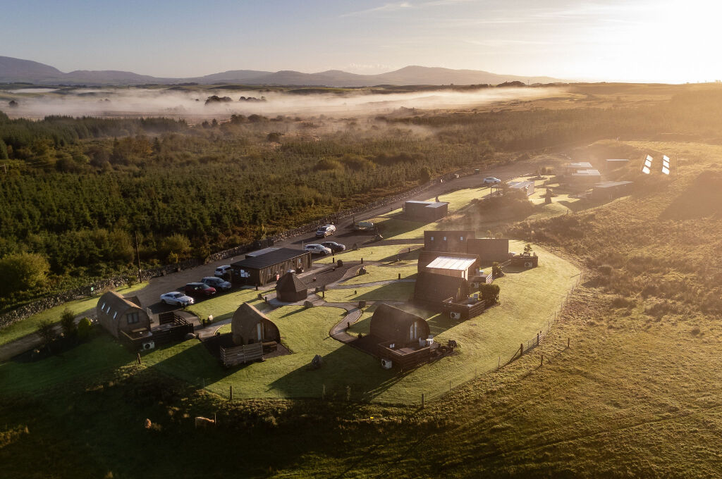 [{'Text': 'Overhead view of the site', 'CultureCode': 'en-GB'}] glamping cabins and grounds, photo 1 of 32