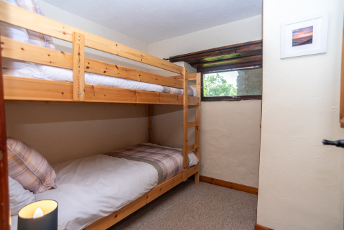 Bunk Room, Sleeps Two - Cosy pine bunks with tartan bedding and a warm nightlight, ideal for children or younger guests in the group