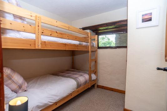 Bunk Room, Sleeps Two - Cosy pine bunks with tartan bedding and a warm nightlight, ideal for children or younger guests in the group