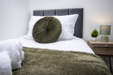 Single bed with soft bedding for added comfort