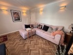 L-shaped sofa comfortably seats up to four guests.