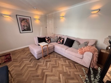 L-shaped sofa comfortably seats up to four guests.
