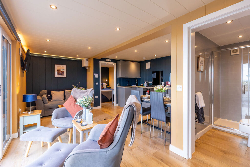 [{'Text': 'Living and dining area', 'CultureCode': 'en-GB'}] glamping cabins and grounds, photo 19 of 32