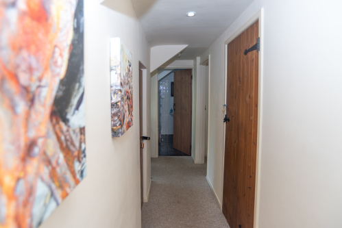 Upstairs you'll find 4 bedrooms; 2 double rooms, 1 with en-suite, and the remaining rooms made up of singles, all with built in wardrobe spaces. The landing also leads to the master bathroom 