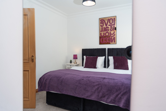View of the bedroom, showcasing a bright and comfortable sleeping space