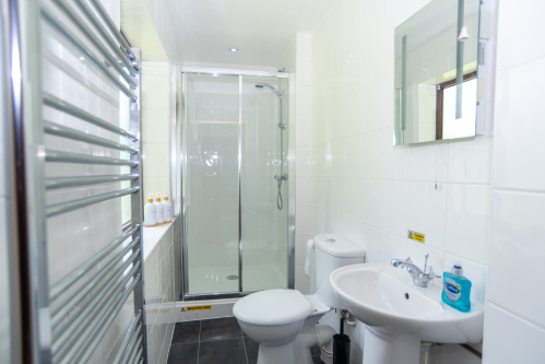 A third bathroom, a downstairs shower room, directly opposite our pink twin room, offering privacy throughout your stay 