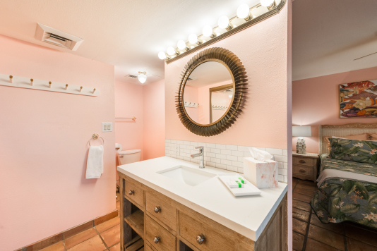 Primary suite vanity , the commode is here (there's no door, but we have a curtain)