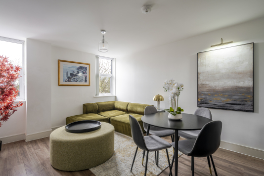 Experience refined comfort in this beautifully designed living room, where sophisticated décor meets effortless elegance. Flooded with natural light, the space features plush seating, stylish accents, and a statement centrepiece that elevates every moment. Perfect for relaxing or entertaining, this room delivers luxury living at its finest.