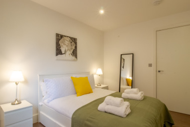 double bed with space for a floor mattress