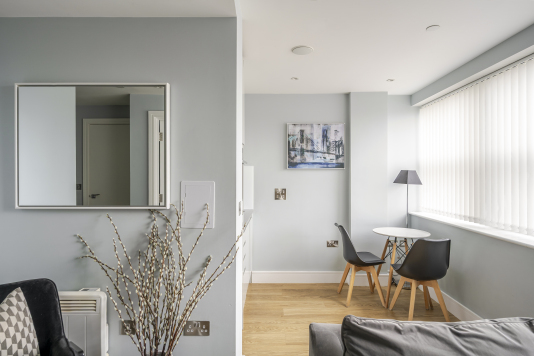 An elegant dining area designed for memorable gatherings, featuring a statement dining table, sophisticated seating, and ambient lighting. This refined space blends style and comfort, perfect for both intimate meals