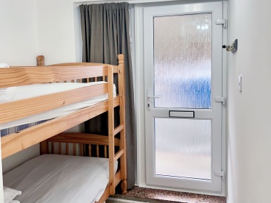 front entrance to apartment and sleeping area