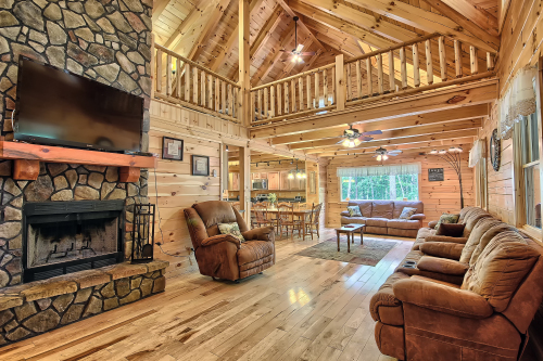 Great Room Fireplace and Sitting area, with part of Open Loft above