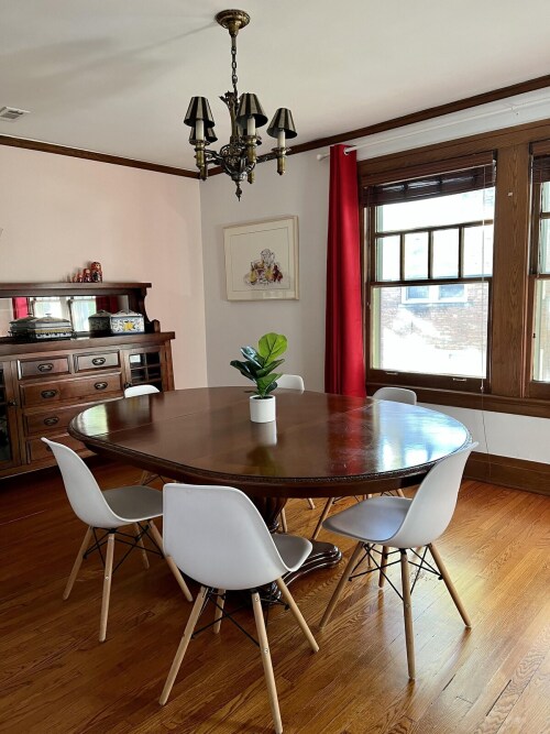 The dining room holds an elegant table  to seat the entire family. 