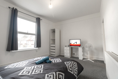 Bright bedroom with large window