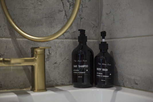 Relax and refresh in this clean and stylish bathroom space.
