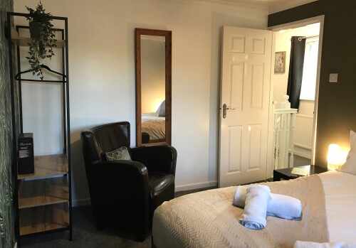 Bedroom 2 - Comfy double bed, wardrobe and seating area - TLC Stay Preston area home