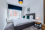Comfortable bedroom with a king-size zip and link bed that can be separated into two singles upon request.