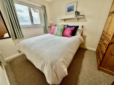 Master bedroom with double bed and sea views