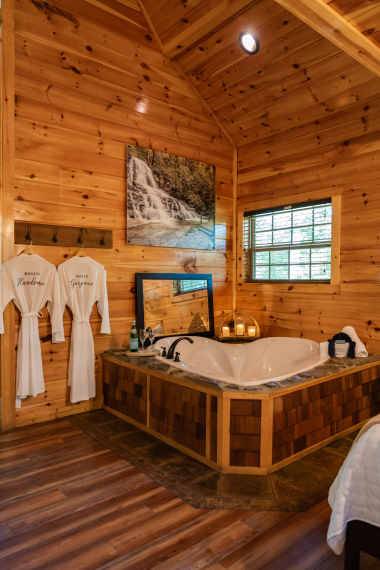 a heart‑shaped tub made for two — candlelight, cozy robes, and quiet connection.