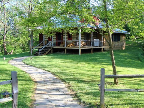 The largest of the 5 historic log cabins this has 2 wrap-around verandas, 1 deck