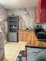 This photo represents the communal kitchenette