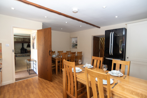 Gather the whole group around the farmhouse table — seating up to 14 with room to spare, high chair provided