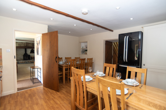 Gather the whole group around the farmhouse table — seating up to 14 with room to spare, high chair provided