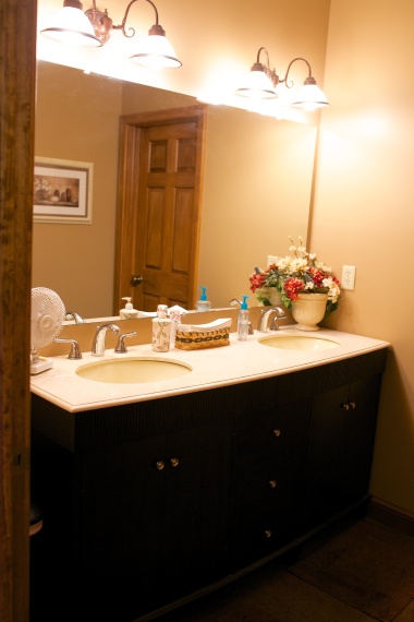 Double vanity with separate spaces for the shower and toilet.  