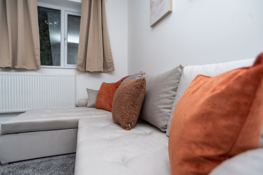 Luxury sofa bed sleeping two, comes ready to be dressed with fresh linens — offering stylish, comfortable extra sleeping space for your stay.