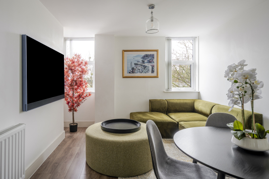 Experience refined comfort in this beautifully designed living room, where sophisticated décor meets effortless elegance. Flooded with natural light, the space features plush seating, stylish accents, and a statement centrepiece that elevates every moment. Perfect for relaxing or entertaining, this room delivers luxury living at its finest.