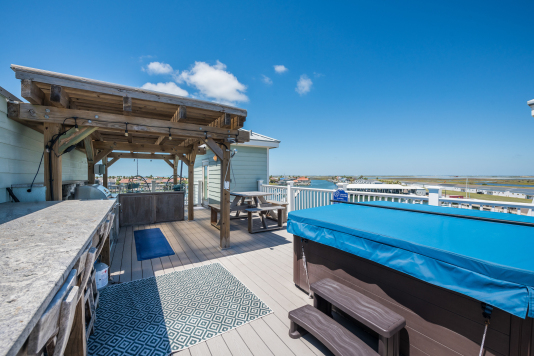 Rooftop has spa, kitchen, gas grill, lounge, gas fire pit, dining area 