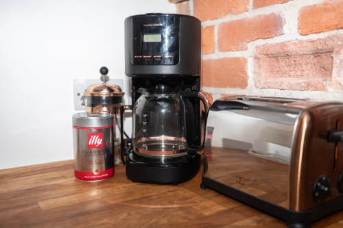 Coffee maker with fresh coffee supplied, plus all the appliances you need for hot drinks on arrival