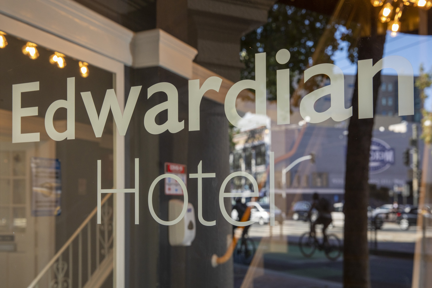 A window with the hotel name on it