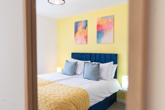 Stylish bedroom with zip-and-link king bed that can be arranged as twins.