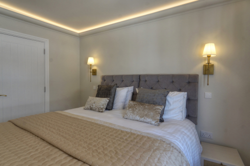 Guest Bedroom 2 with ambient surround, ceiling and reading lights