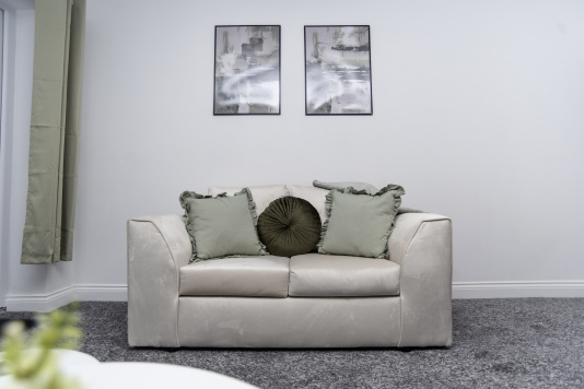 A cosy lounge area with a sofa that easily converts into an extra bed - perfect for flexible sleeping arrangements.
