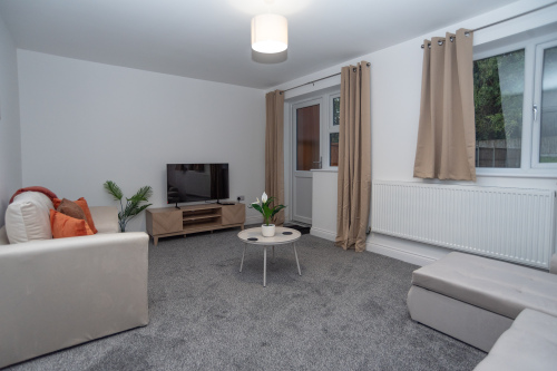 Spacious living room with a comfy sofa and sofa bed, Full HD Smart TV and super-fast WiFi — perfect for relaxing, streaming or unwinding after a long day.