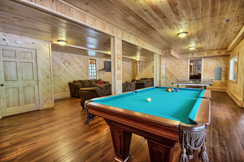 Closeup of Pool Table, with Ping Pong Table beyond, and Entertainment Room to left, The Western Lodge