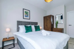 Comfortable bedroom with a king-size zip and link bed that can be separated into two singles upon request.