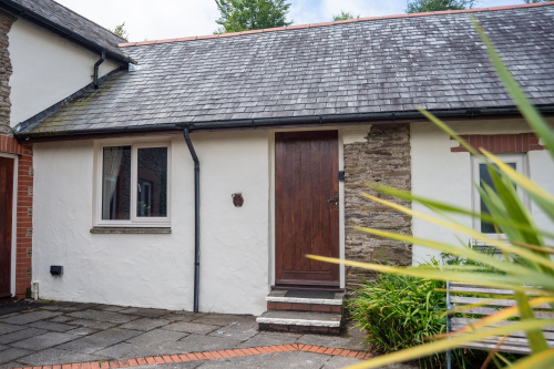 Charming stone-and-render cottage nestled within the peaceful grounds of Old Mill Cottages.