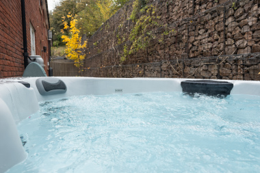 Private courtyard hot tub, freshly cleaned and ready for guests to sink into warm, soothing bubbles.
