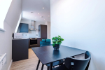 A comfortable sitting area with a table and chairs for relaxing or dining.