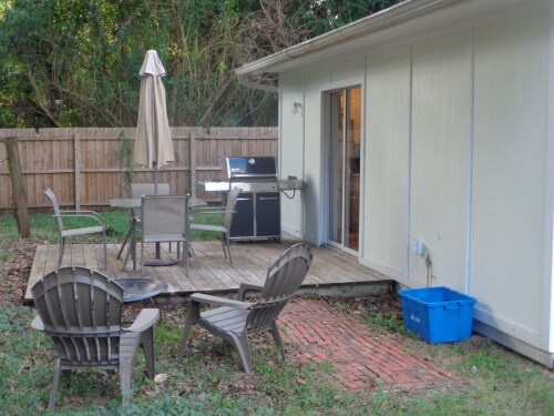 large deck with outdoor seating & Weber gas grill