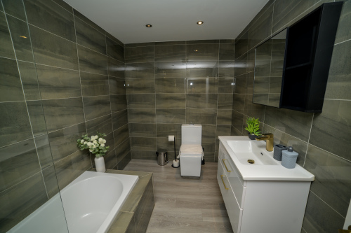 A fresh, well-maintained bathroom with essential amenities provided.