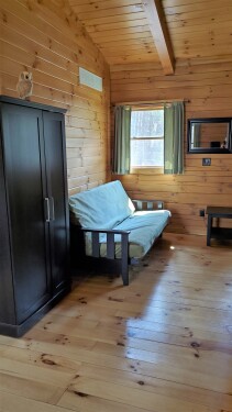 Futon in loft screened from main area