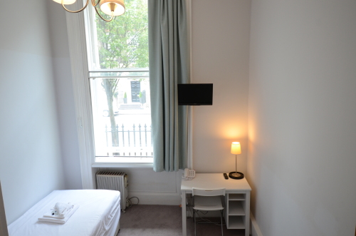 Single  Bed studio for one persons at Amber Residence Apart Hotel.  Ground Floor, Modern Kitchen  and Furniture , with Natural Light