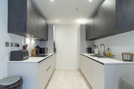 Modern fully equipped kitchen with everything needed for cooking during your stay.